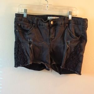 Distressed denim short with lace accent